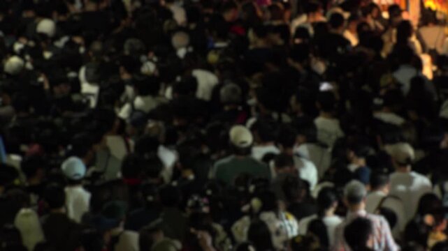TOKYO, JAPAN - MAY 2026 : Blurred view of crowd of people at summer festival. Japanese festival concept video.