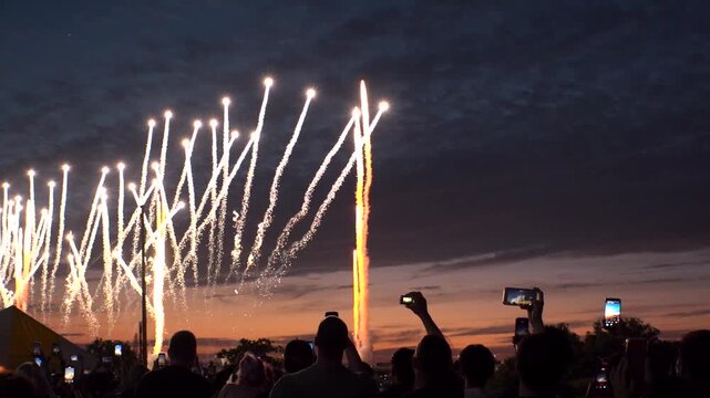 TOKYO, JAPAN - MAY 2026 : View of fireworks and back shot of people. Japanese summer season and festival concept video. Slow motion shot.
