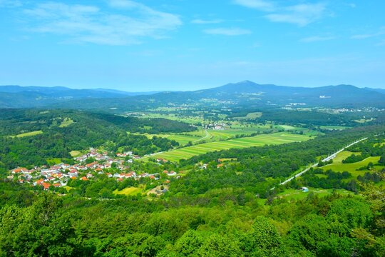 View of Narin village at Narinski polje and Ko&scaron;anska dolina with fields and forest in sumer in Notransjka, Slovenia