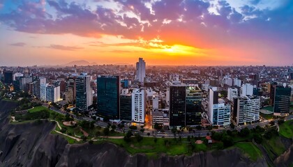 Obraz premium Vibrant Urban Skyline Glowing at Sunset Above Coastal Cliffs