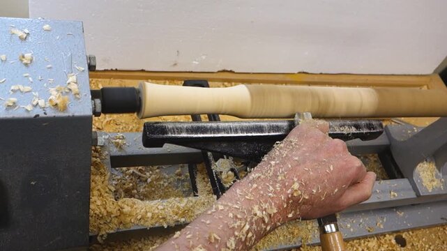 The work of a master on a wood lathe. Manufacturing of wood parts. 