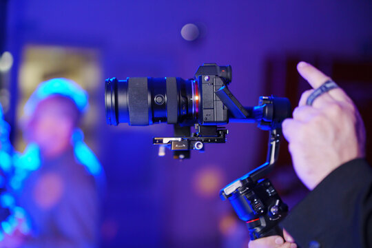 Hand using professional camera gimbal stabilizer