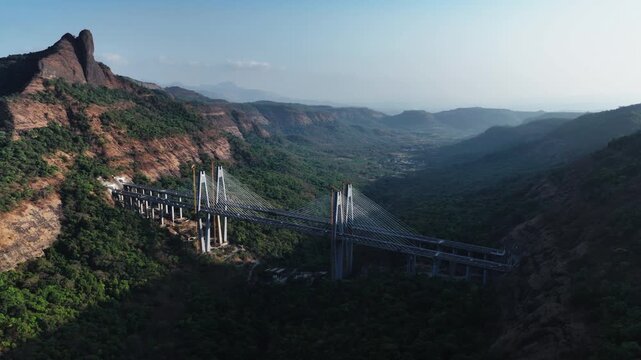 A stunning aerial view of the Mumbai-Pune Missing Link, showcasing one of India&rsquo;s most ambitious expressway projects, cutting through scenic hills and valleys.