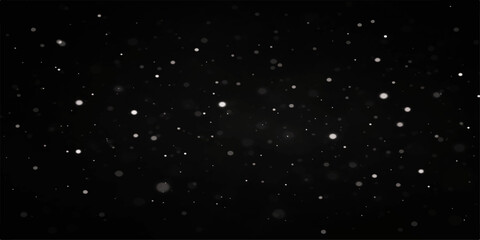 Falling Snow on Black Background: Gentle snowflakes drift down against a dark, moody backdrop, creating a serene and quiet winter atmosphere. © Nipa