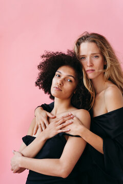 Beauty and Connection Between Two Friends on a Vibrant Backdrop