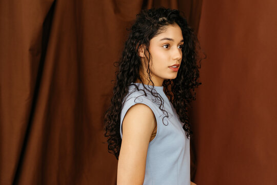 Woman withcurly hair looking to side