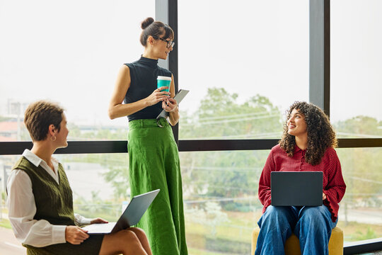 Business Team Members Share Ideas in Modern Office Space