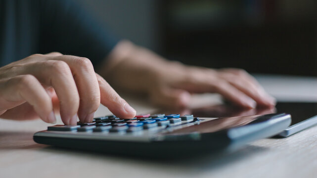 audit auditing auditor calculate calculation calculator accounting.Close-up of a professional using a calculator for financial calculation, accounting, tax planning and audit management.