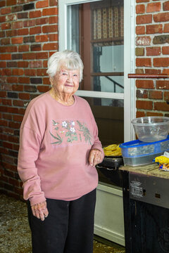 Old Woman Frying Fish at the Lake