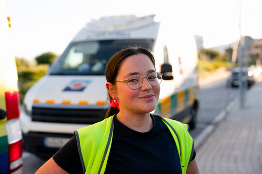 Woman paramedic wearing high-visibility vest