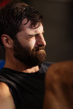 Man Struggling Through Intense Gym Workout Session