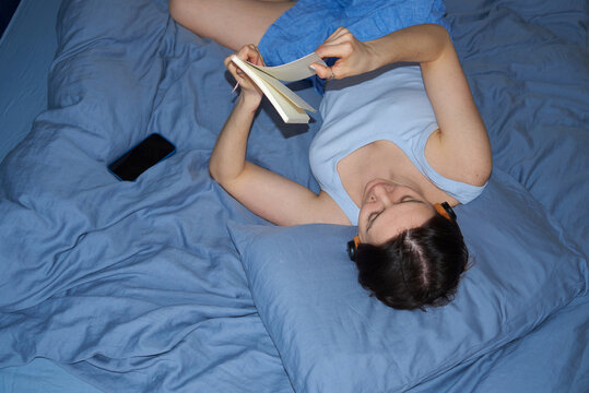 Woman flips through her journal entries