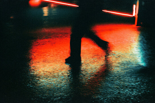 Footsteps on Wet Asphalt at Night