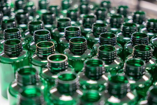 Green plastic bottles production line in factory