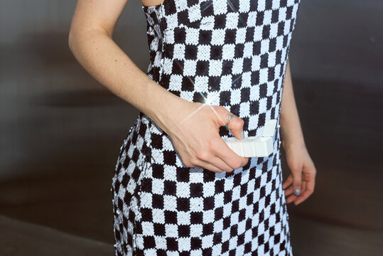 Woman holding a pill organizer