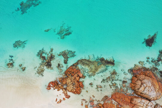 Shallow seawater, rocks and a small beach. Eyre Peninsula. Australia.