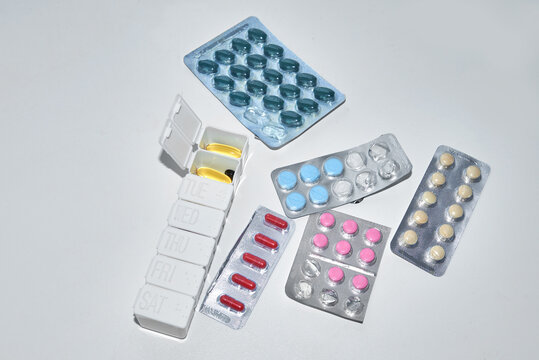 Different blisters with pills and pill organizer
