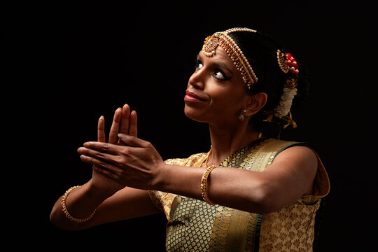 Indian bharatanatyam dancer performing traditional mudra gesture