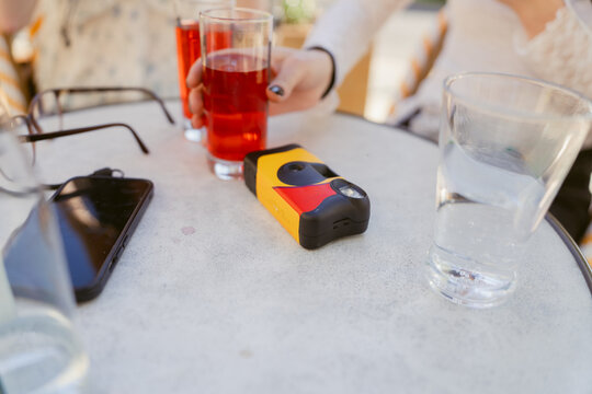 disposable camera and drinks on table