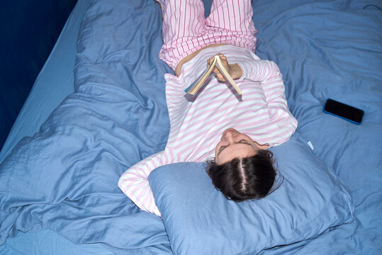 Woman relaxing in bedroom