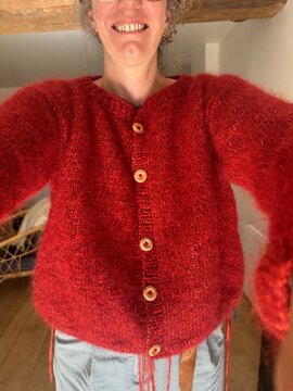 UGC Selfie of woman who just finished knitting cardigan