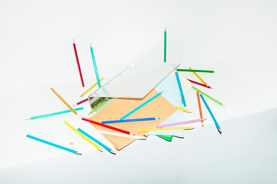 Contemporary office image of binder full of papers and pencils