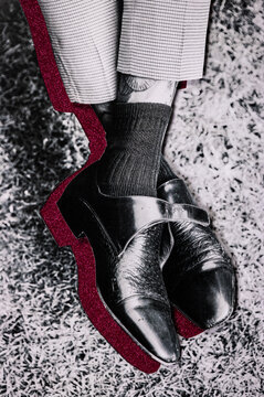 Analog collage of mans shoes with ruby detail.