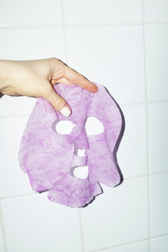 Peeling of a beauty skincare beauty facemask with flashlight