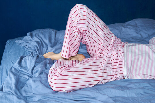 Woman lying on a bed