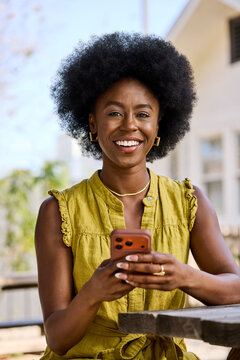 Happy Woman on Phone Outdoors