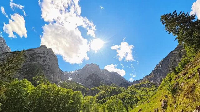 4K Timelapse alpine video with moving clouds at Kaiserbachtal valley, Griesenau, Wilder Kaiser, Kitzbuehel, Tyrol, Austria