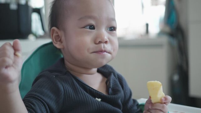 A cheerful child indulges in a tasty snack, showcasing a moment of joy and curiosity. The setting captures the innocence and delight of childhood, making it a relatable scene for families.