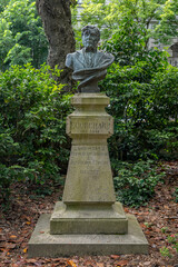 Obraz premium Nantes, France - 05 09 2026: The botanical garden. Bust sculpture of Doctor Ecorchard, creator of the Botanical Garden