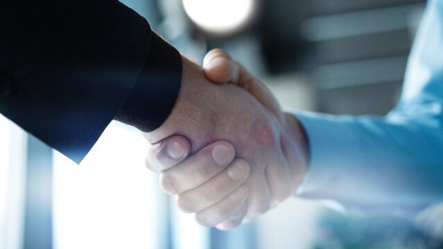 Partnership, teamwork and shaking hands for agreement, consulting or introduction in meeting