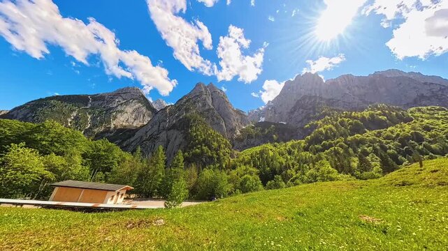 4K Timelapse alpine video with moving clouds at Kaiserbachtal valley, Griesenau, Wilder Kaiser, Kitzbuehel, Tyrol, Austria