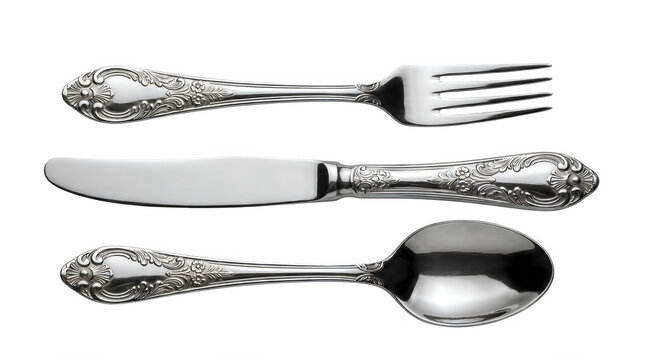 Vintage silver cutlery set with ornate floral patterns, antique stainless steel fork knife and spoon, elegant silverware collection on transparent background