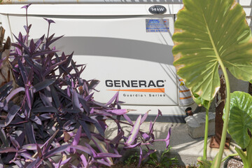 Naklejka premium old Generac Guardian Series, an automatic home standby generator with plants, Toronto