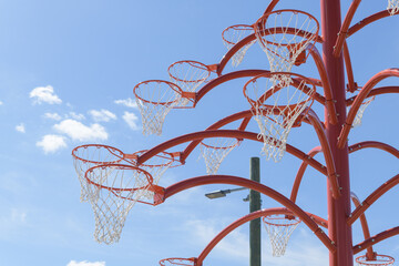 Naklejka premium Orange Functional tree, a 20-foot-tall pubic art sculpture, by Cuban artist Alexandre Arrechea, Toronto's Port Lands, right in front of the historic Old Fire Hall 30 (39 Commissioners Street)