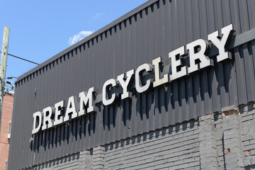 Naklejka premium old sign outside Dream Cyclery, a bicycle shop, located at 941 Kingston Rd near Silver Birch Av, The Beaches, Toronto
