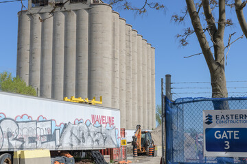 Fototapeta premium Eastern Construction sign and north/west facade of Victory Soya Mills Silos, 350 Lake Shore Blvd E, Toronto