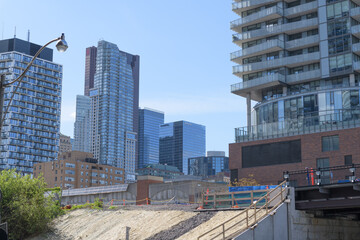Fototapeta premium looking northwest from Lake Shore Blvd E and Lower Jarvis St to (at left) Market Wharf, a condo, and office buildings One King St / Scotia Plaza, Toronto