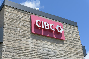 Fototapeta premium wall-mounted sign outside CIBC bank branch at 450 Danforth Rd, intersection of Birchmount Rd, Scarborough, Toronto