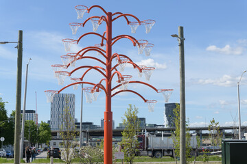 Fototapeta premium wide view of Orange Function (sometimes referred to as Orange Functional) by Cuban artist Alexandre Arrechea installed in front of Old Fire Hall 30 at 39 Commissioners Street, Toronto