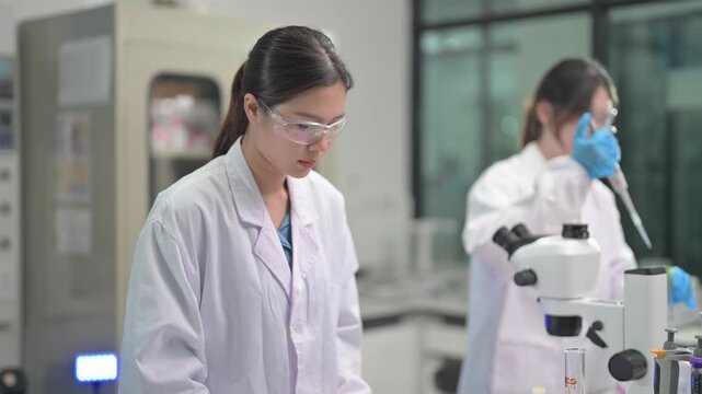 Lab work in a research facility with two scientists conducting experiments on samples