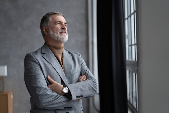 Portrait of a confident mature businessman near the window.
