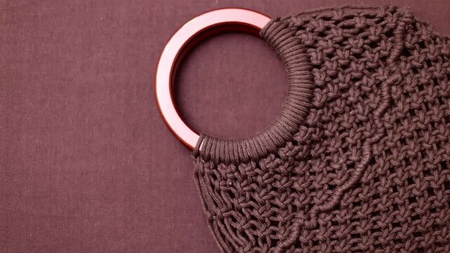 Close-up of dark brown knitted fabric texture