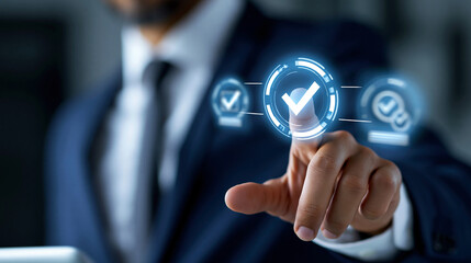 Obraz premium Anonymous businessman in a dark suit touching a holographic compliance screen with glowing checkmarks and regulatory adherence symbols, defocused, with copy space