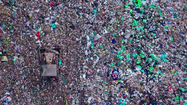 Bulldozer Pushing Municipal Waste At Large Landfill Site
