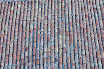 Weathered Terracotta Roof Tiles Pattern Showing Vintage Mediterranean Texture and Repeating Lines © © Raymond Orton