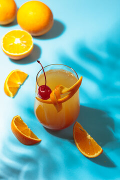 Cocktail Tequila sunrise with orange juice, silver tequila, grenadine, and ice.